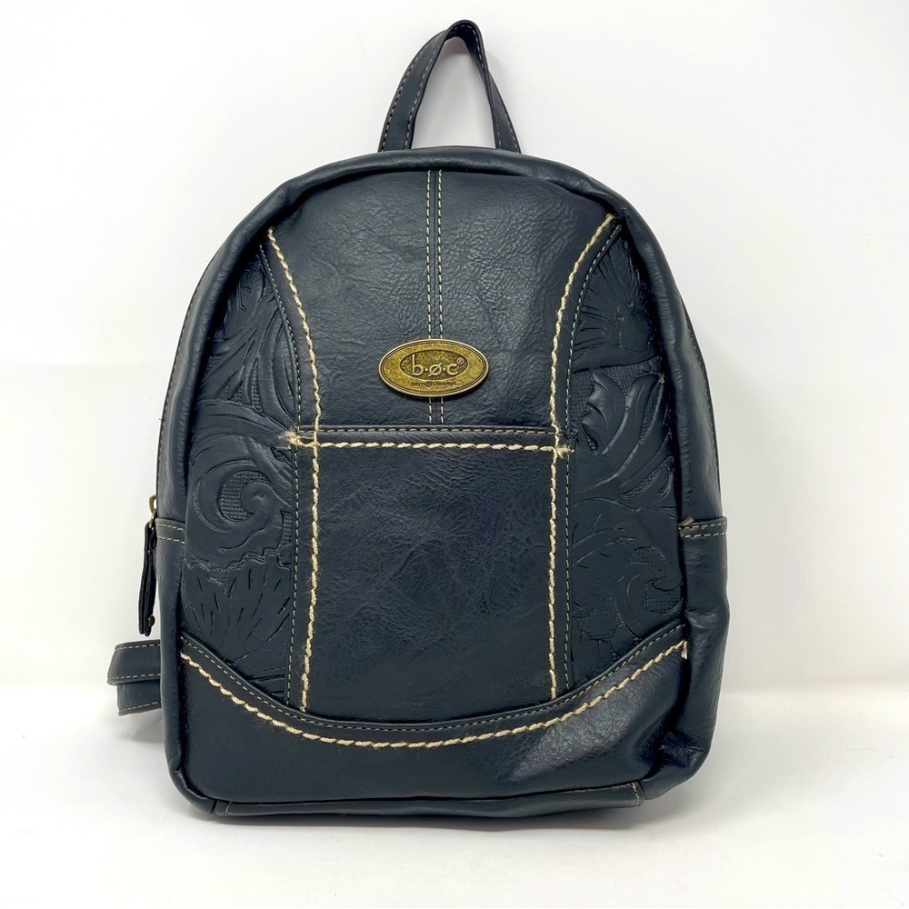 Born Concept black embossed mini backpack with adjustable straps.